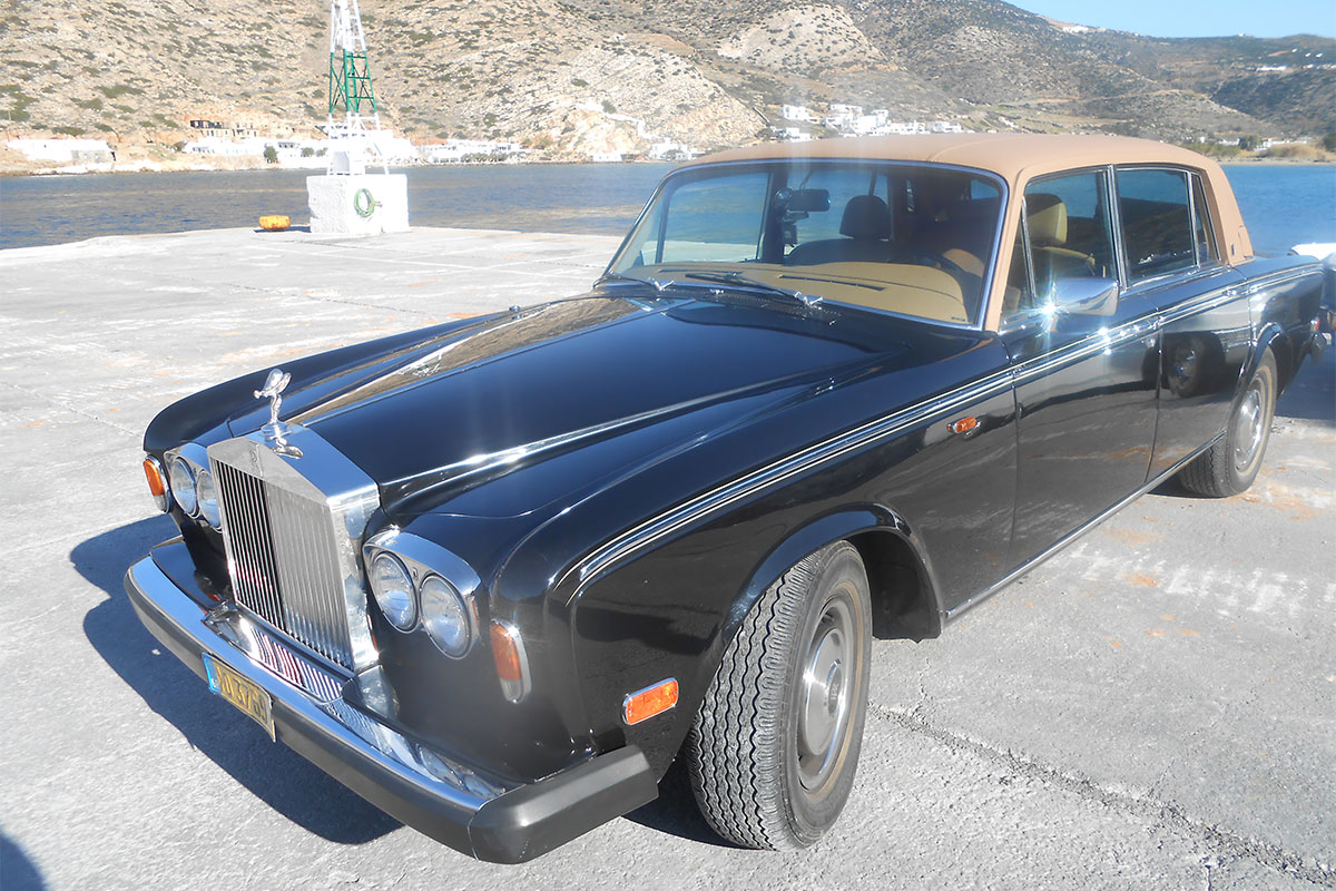 Transportation with an antique car at Sifnos